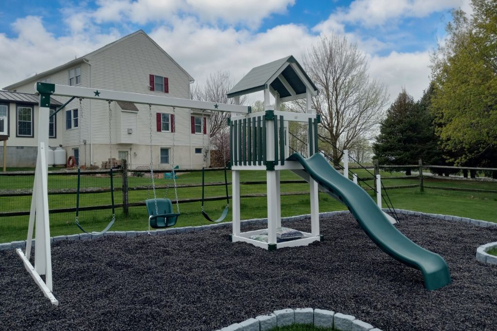 swingset for home backyard with rubber mulch